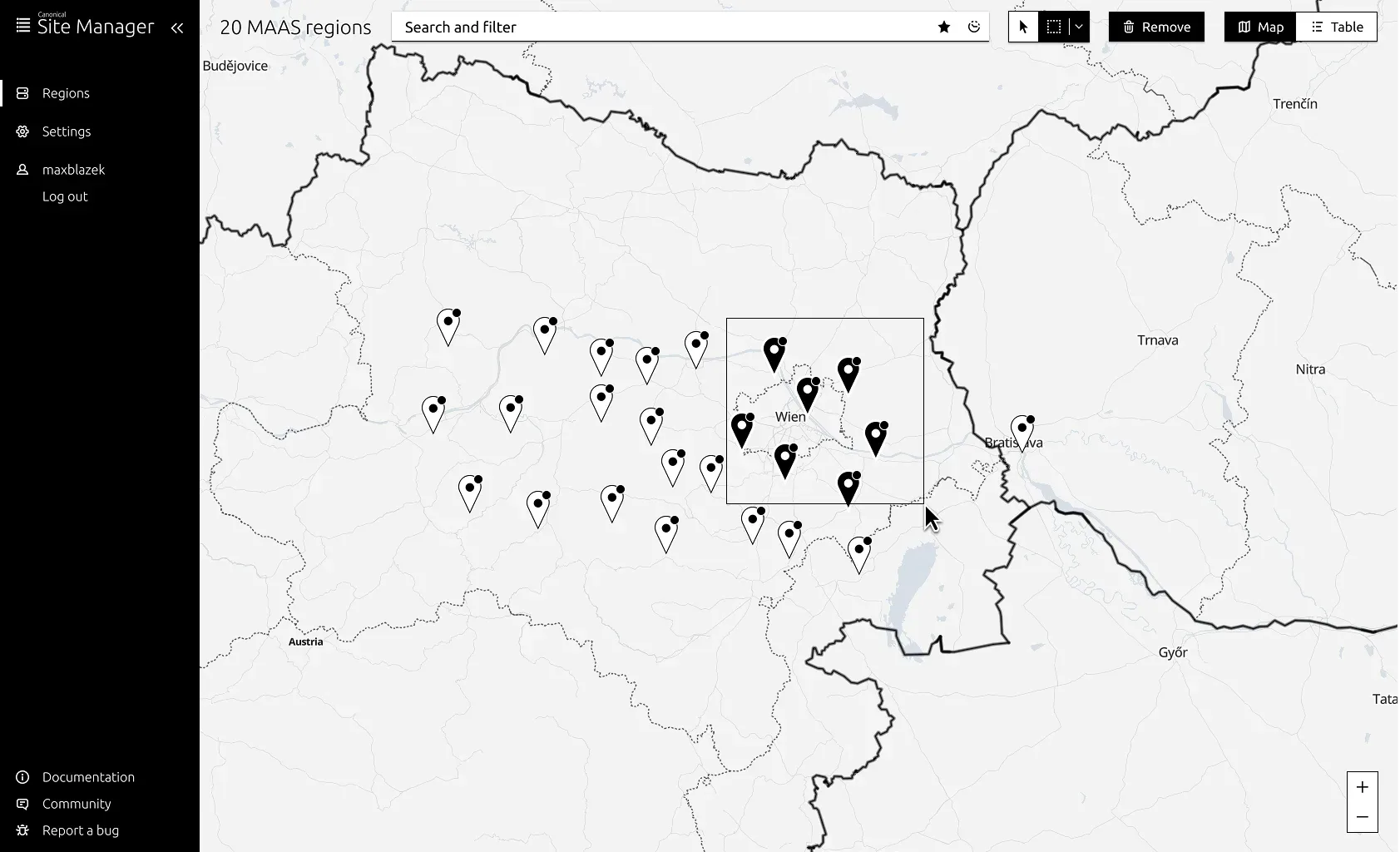MAAS Site Manager wireframe showing European map with clustered server location markers, with dense clusters around Vienna area and scattered markers across other European cities, including sidebar navigation for Regions, Settings, and user account